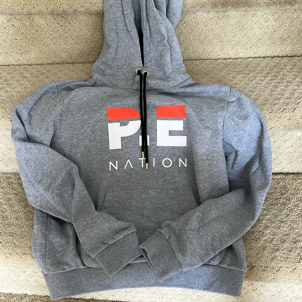 Women’s PE Nation Hooded sweatshirt size M. Unworn and in perfect condition.